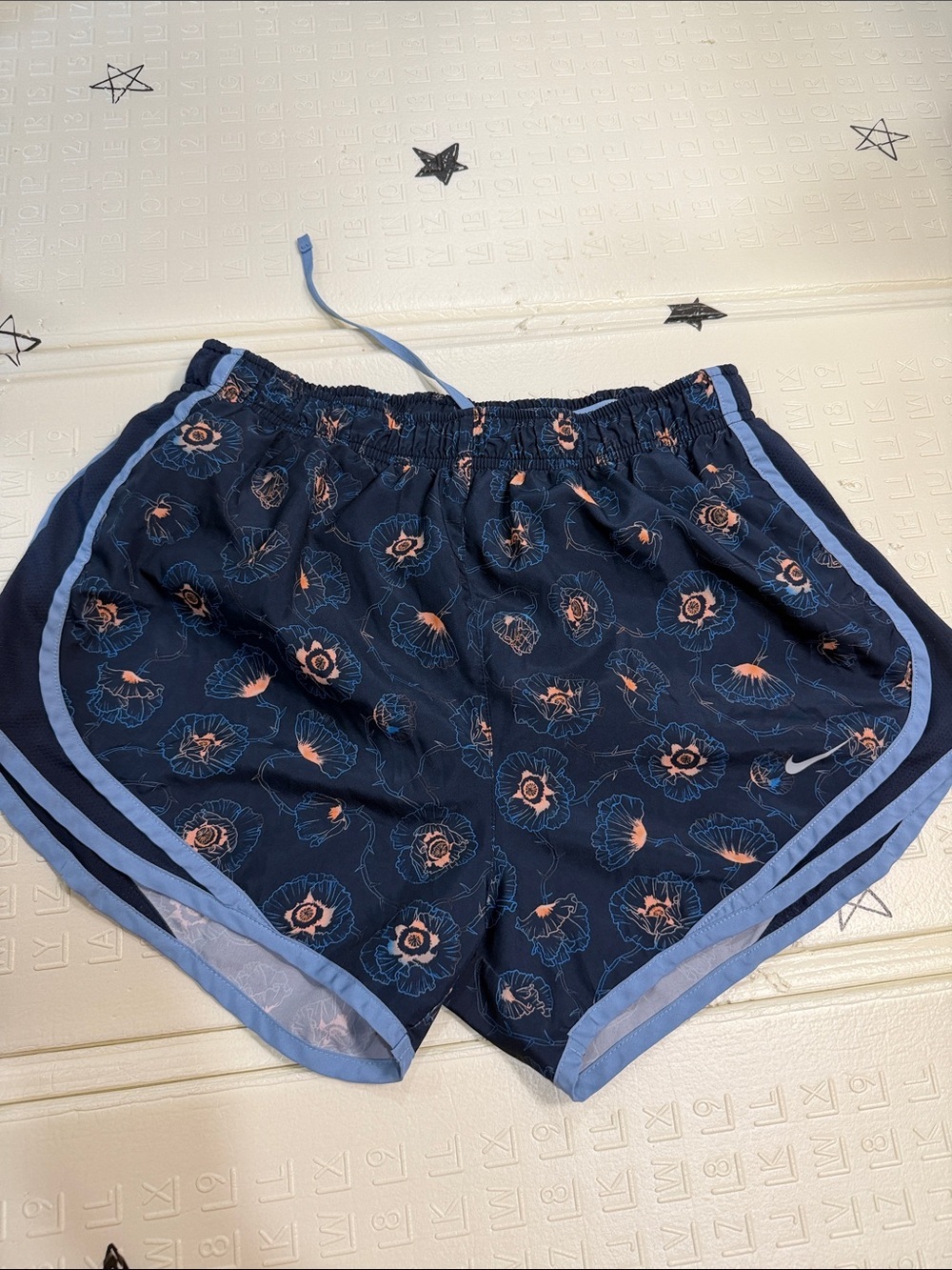 Nike Women's Navy Floral Athletic Shorts with Light Blue Trim